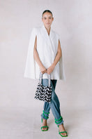 SAC DE SOUL Clash of Prints feather-patterned black and white shoulder bag with adjustable strap and modern design.