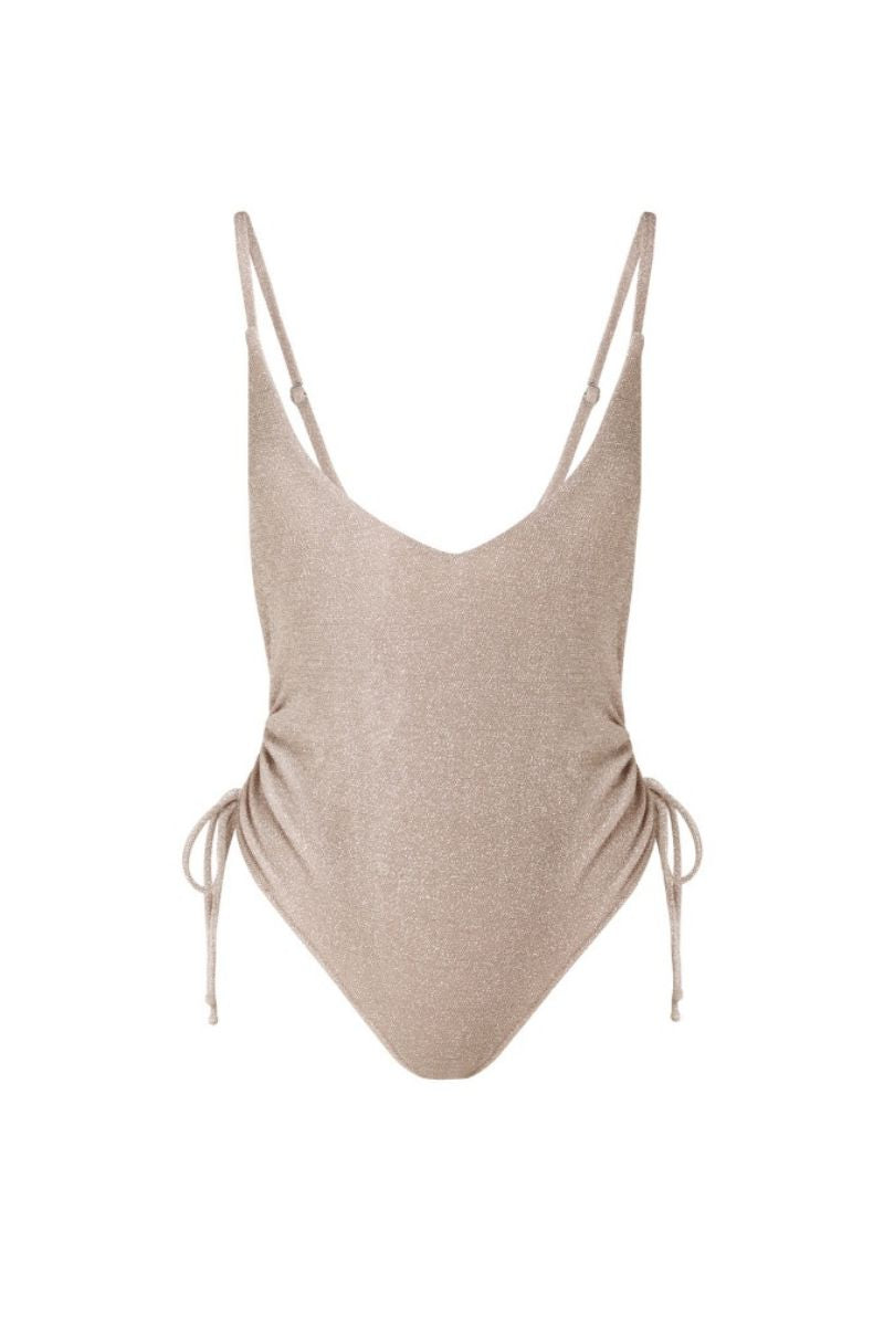 Beige Francesca swimsuit by Suncillo, featuring a stylish one-piece design with smooth fabric and classic cut, displayed on a model.