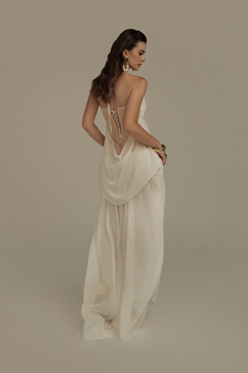 Poem Halcyon white maxi dress displayed on a hanger, featuring a flowing fabric and elegant design for casual or formal occasions.