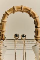 Waiwai Rio Alix Bambu Bag in Crystal, a stylish top handle bag with transparent acrylic design and bamboo accents.