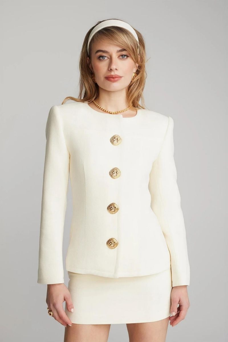 Nana Jacqueline Lisette white mini skirt made of lightweight fabric, styled with a fitted waist and short hem for a chic look.