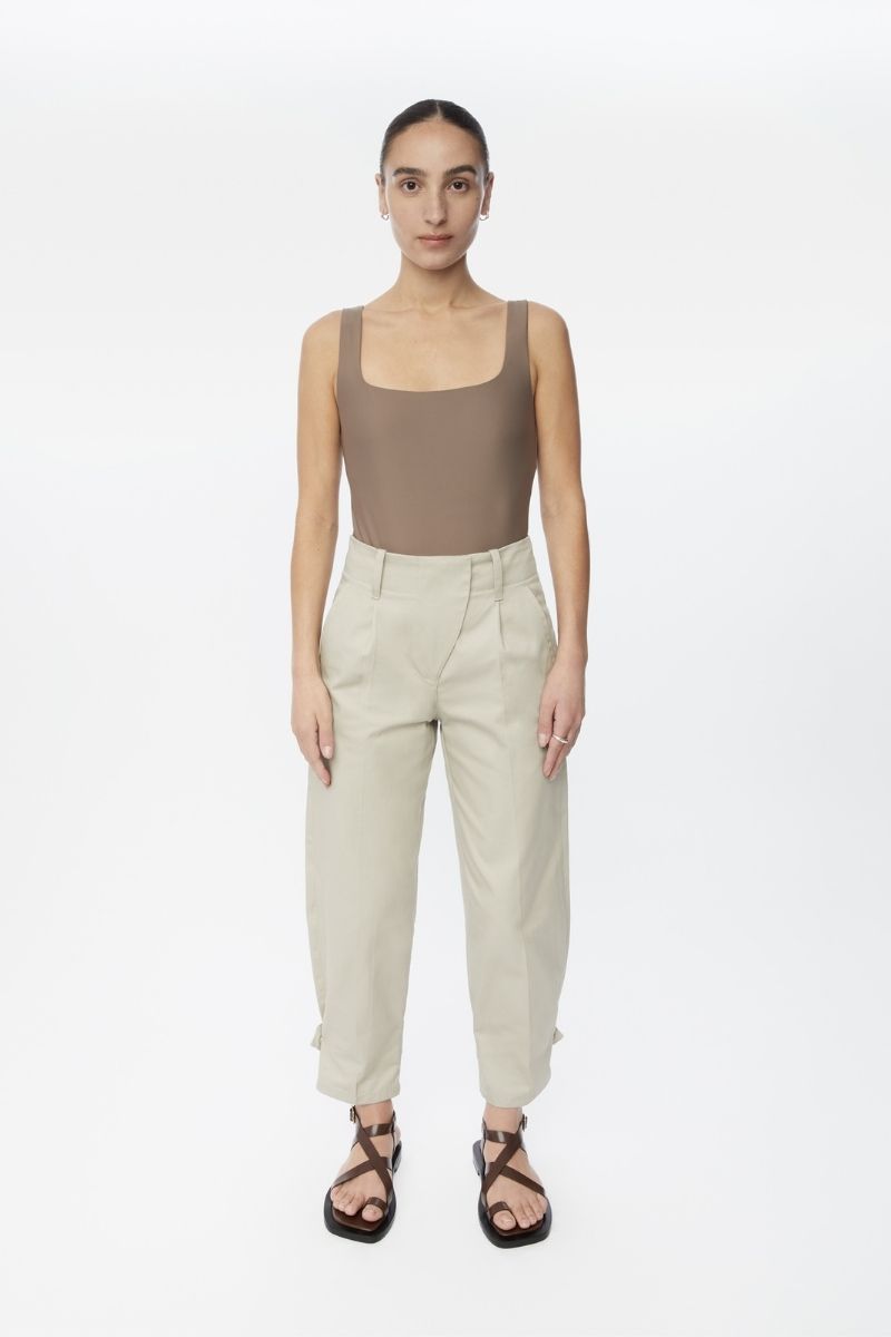 Light beige canvas cotton pants by Dāl the Label, showing a relaxed fit with side pockets and a comfortable waistband.