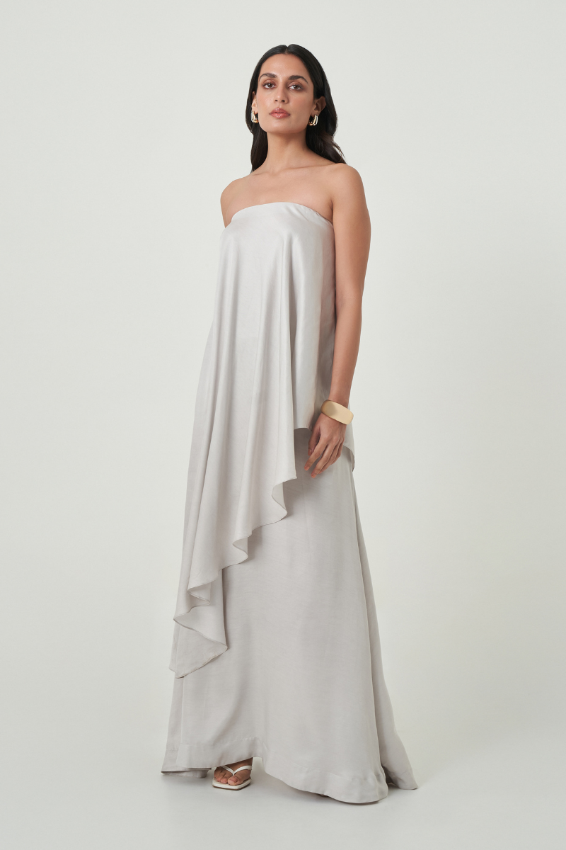 Light gray Amal Top by Summer Away, stylish casual top with a relaxed fit, displayed on a hanger against a neutral background.