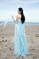 Valenciani blue maxi dress with all-over fringe, flowing design, and sleeveless style, perfect for summer or casual occasions.