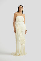 Deme By Gabriella Naomi maxi dress in off-white, flowing fabric with a relaxed fit and elegant design, displayed on a hanger.