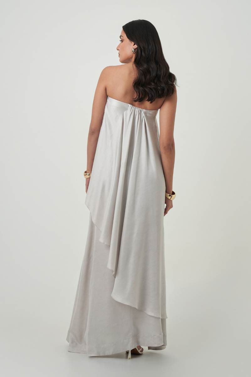 Summer Away Amal Gray Maxi Skirt, flowy and stylish, shown in a natural sitting position with soft fabric details.