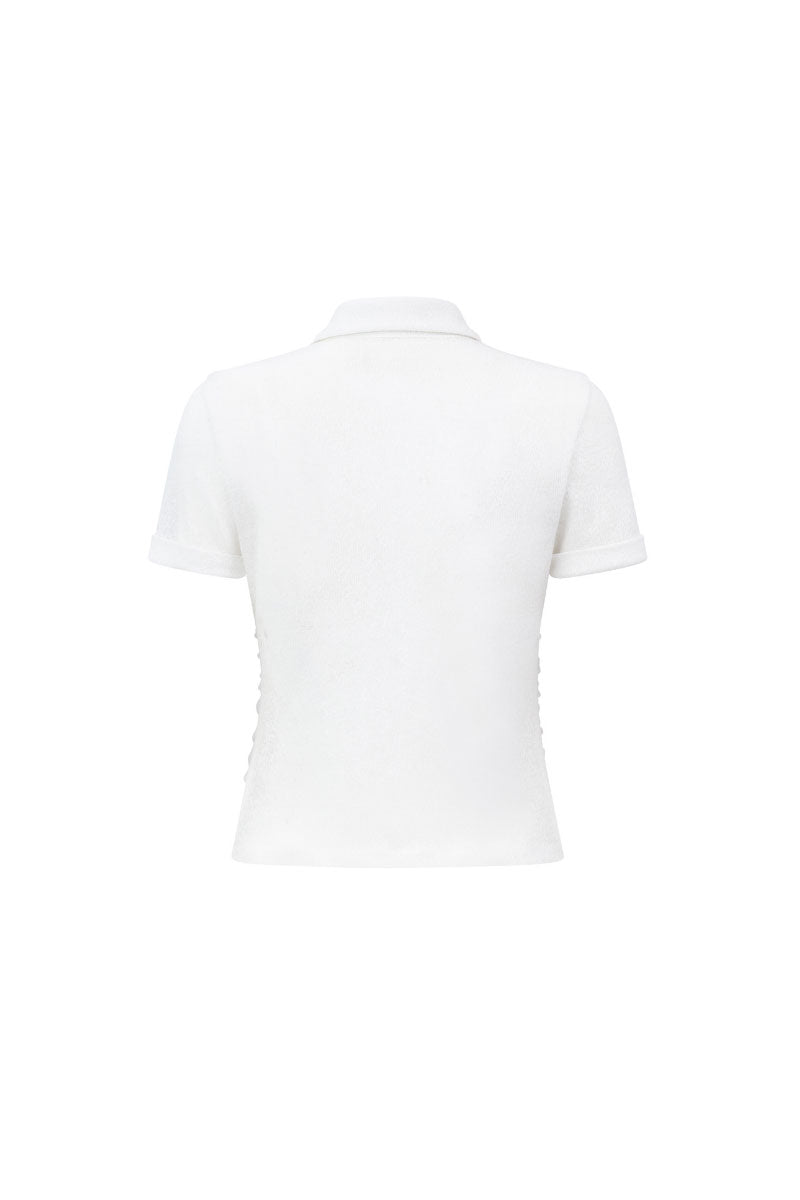 Arti Apparel ELYSS TOP, stylish women's top in soft fabric, featuring a fitted design and elegant neckline.