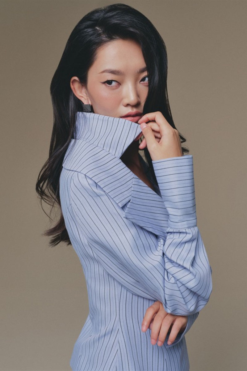 Blue Selena shirt by Keira Tong, lightweight casual shirt with button-front and long sleeves, displayed flat on a white background.