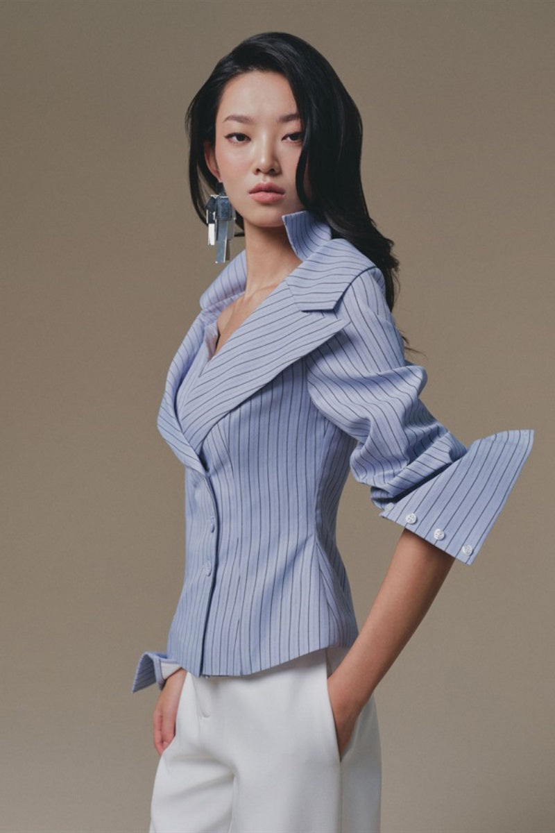 Blue Selena shirt by Keira Tong, featuring a casual fit with a button-up front and collar, displayed on a neutral background.