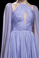 21Six Veri Peri Dalia silk cut-out gown featuring a flowing silhouette and intricate cut-out details in vibrant purple.