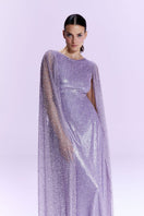 Nur Karaata La Mamounia purple gown displayed on a hanger, featuring elegant fabric and intricate details.
