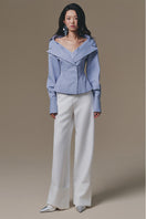 White Selena pants by Keira Tong, featuring a stylish fit and smooth fabric, displayed on a model against a plain background.