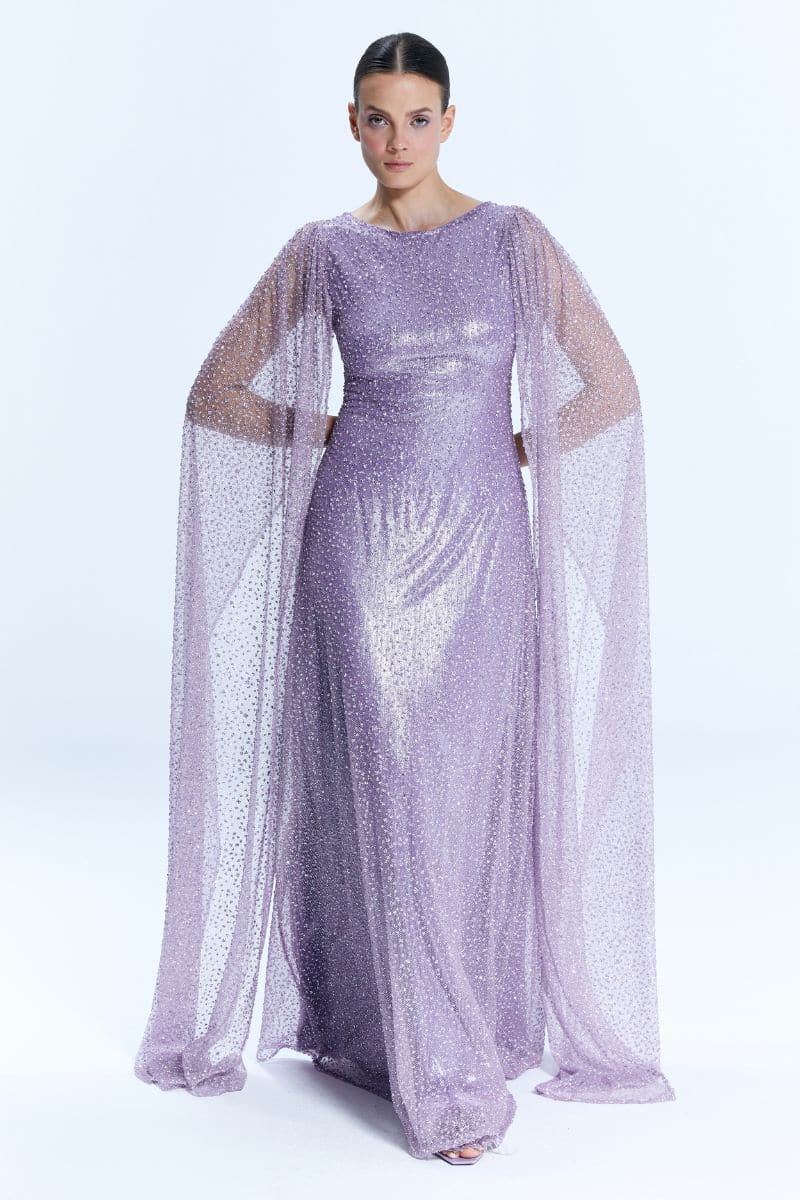 Nur Karaata La Mamounia purple gown with flowing fabric and elegant design, showcased on a model.