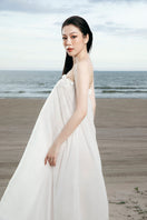 White strapless maxi chiffon dress by Valenciani, flowing and elegant, perfect for formal occasions or summer events.