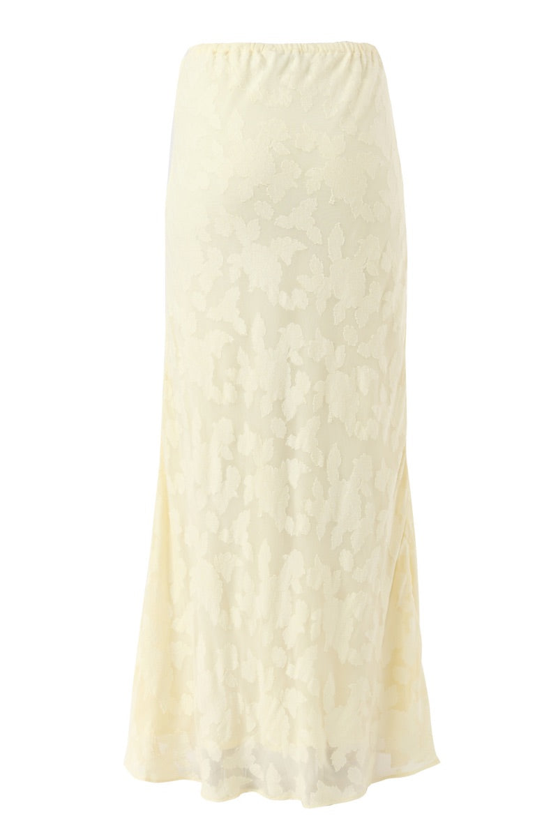 Light yellow maxi skirt from Summer Away's Evora collection, featuring a flowing, elegant design perfect for warm-weather wear.