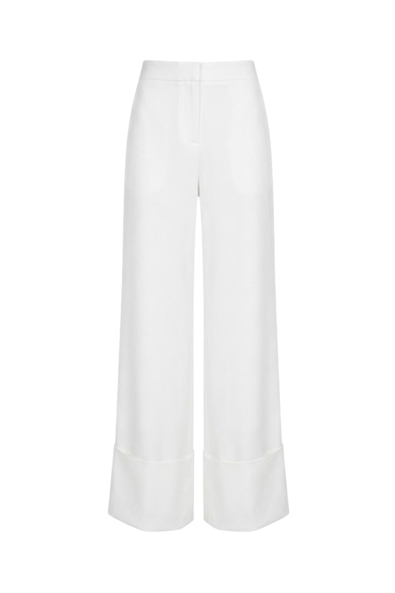 White Selena pants by Keira Tong, showcasing a stylish, tailored fit with a smooth fabric and clean design.
