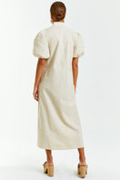 Mestiza New York Ellianna Barong midi dress in flaxen with flowing fabric and intricate embroidery, displayed on a mannequin.