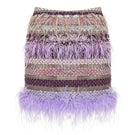 Lalo Avril mini skirt in purple multi with a fitted waist and vibrant, multicolored pattern, styled for a trendy look.
