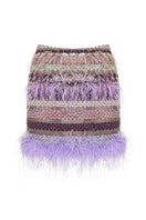 Lalo Avril mini skirt in purple multi with a fitted waist and vibrant, multicolored pattern, styled for a trendy look.