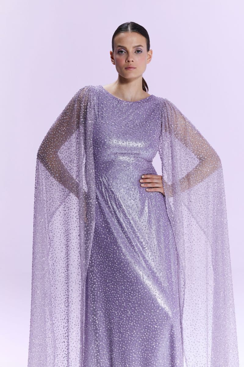Nur Karaata La Mamounia purple gown with flowing fabric and elegant design, showcased in a full-length view.