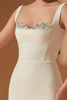 White Jensen crystal bodycon gown by 21Six, featuring a fitted silhouette and sparkling crystal embellishments.