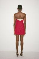 Nué Amaryllis dress, a stylish mini dress with floral pattern, fitted waist, and sleeveless design, perfect for summer occasions.