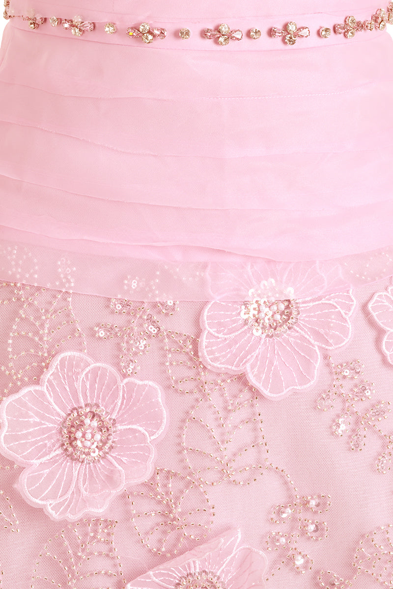 Pink strapless gown with floral details by Happy Clothing, featuring a flowing fabric and elegant design.