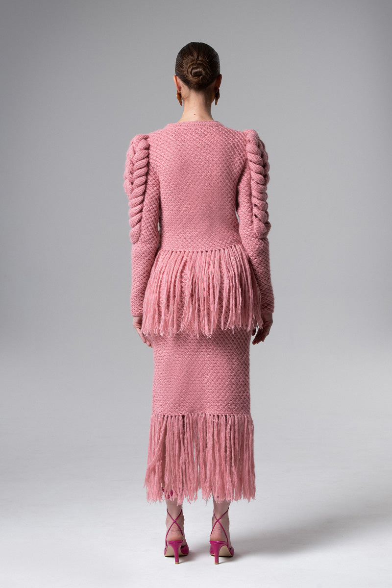 Pink fringe midi skirt by Liya, featuring flowing fabric and stylish fringe detailing perfect for trendy fashion looks.