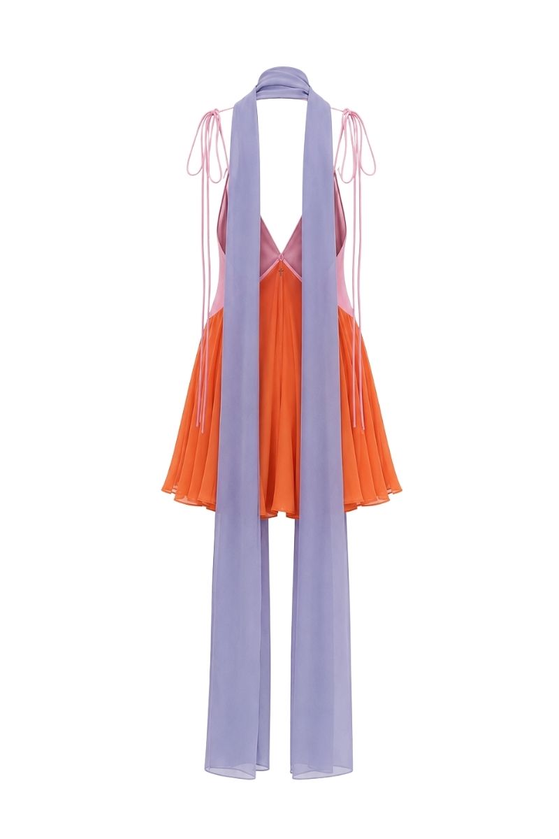 Sisters Kimberly mini dress in peachy pink, sleeveless with a fitted bodice and flared skirt, perfect for warm-weather wear.