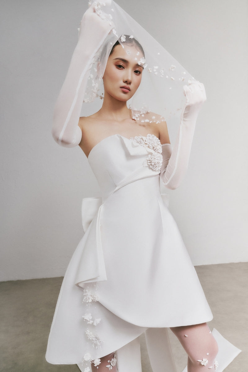 White Plan Jaspone Mini Dress displayed on a hanger, featuring a stylish and versatile design ideal for casual or semi-formal wear.