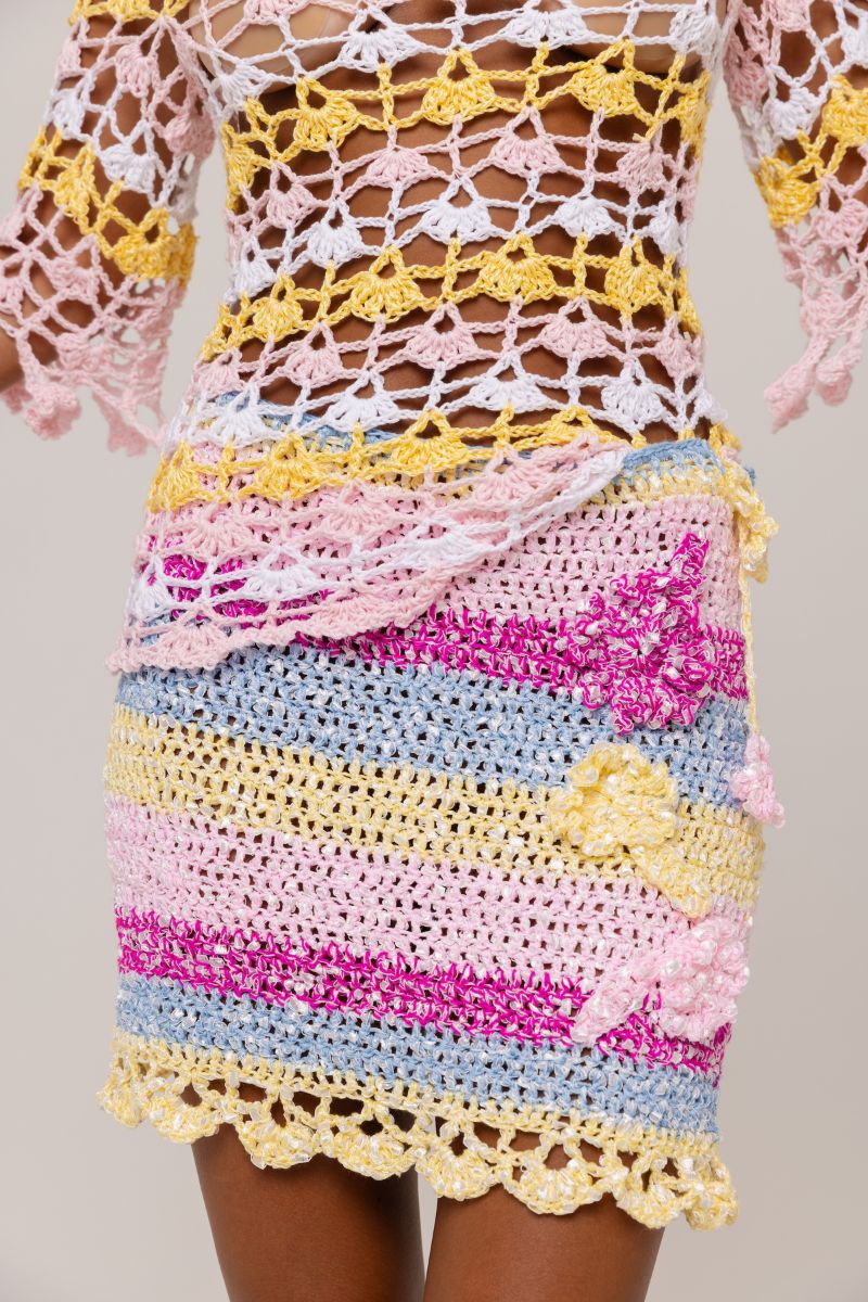 Handmade mini crochet skirt by Andreeva featuring intricate patterns and a fitted waist, perfect for casual summer wear.