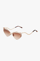 Brown Forget Me Not sunglasses by Moy Atelier with round frames and tinted lenses, stylish and protective eyewear.