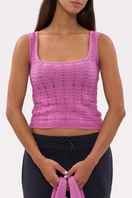 Pink La Granni Marsito top featuring a stylish design, displayed on a hanger with a soft fabric texture.