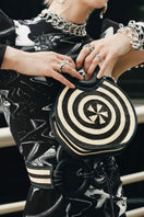 Adriana Castro Zenú Mini Raffia and Leather Top Handle Bag in black with woven raffia accents and sleek leather details.