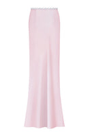 Light pink Stolen Stores maxi skirt with flowing fabric and waist tie, shown on a model in a full-length view.