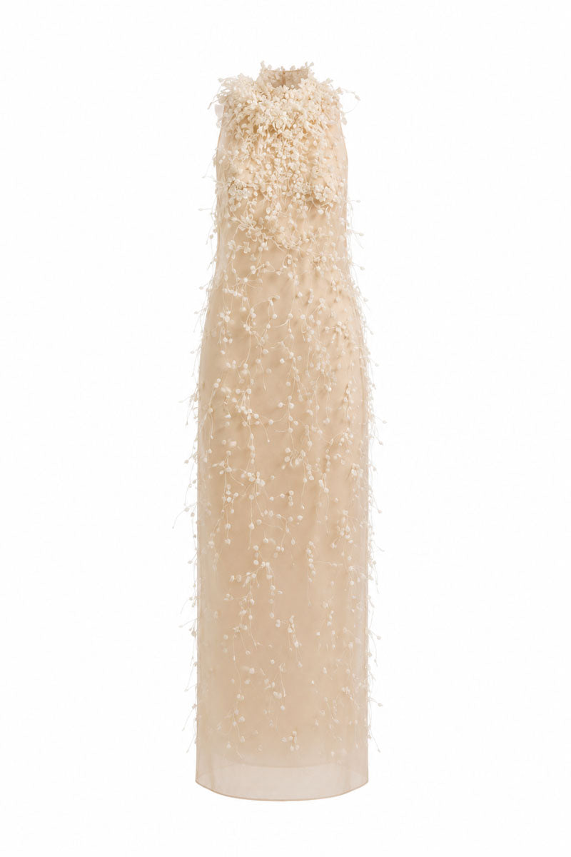 White Plan Maliston gown featuring a flowing design with elegant fabric and detailed neckline, perfect for formal occasions.