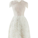 Beige MELINA A-line organza mini dress from Happy Clothing, featuring a flowy, lightweight fabric and elegant silhouette.