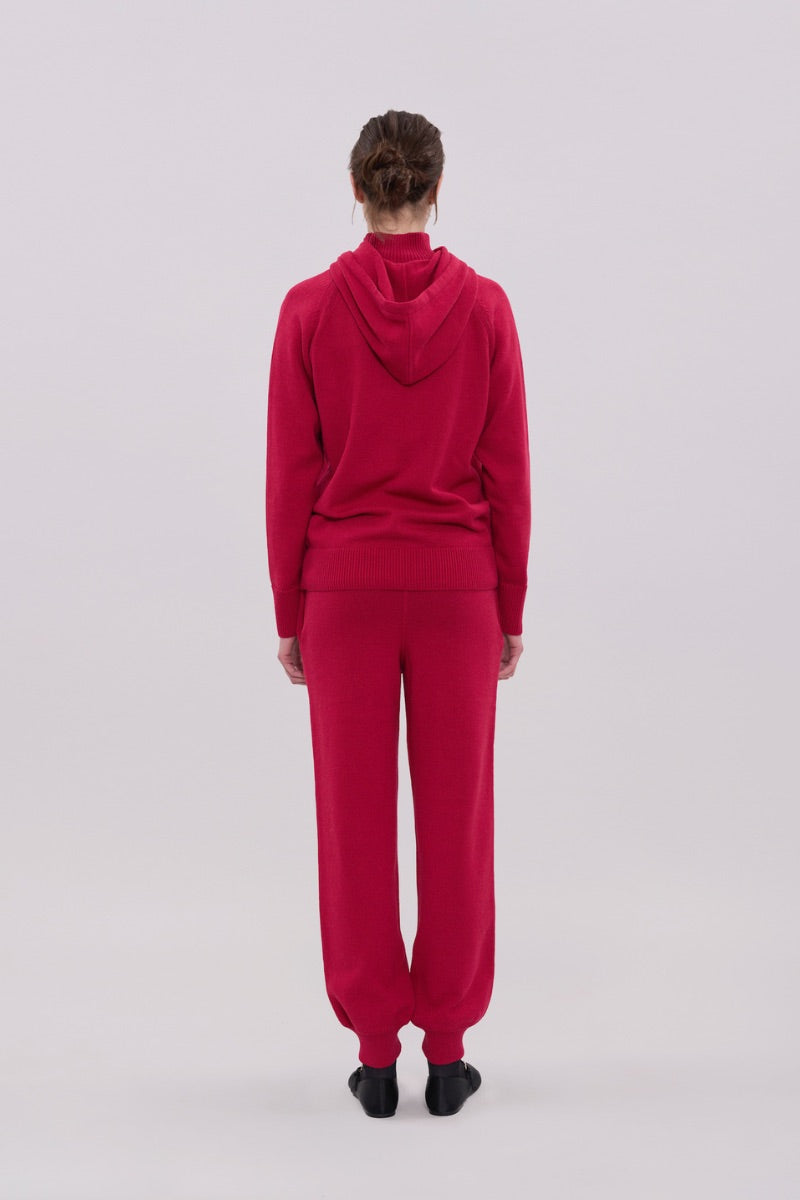 La Granni burgundy knitted roll neck hoodie sweater showing the cozy, textured fabric and relaxed fit.