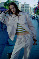 Cream ColoReve Soft Cave Biker Jacket with plush texture, shown on a model, featuring a relaxed fit and stylish design.
