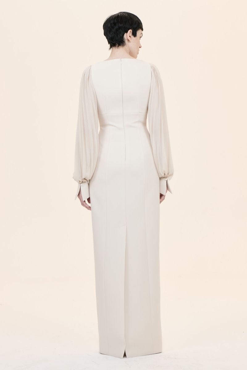 Nihan Peker NAVİGLİ gown featuring elegant fabric with intricate detailing and a flowing silhouette.
