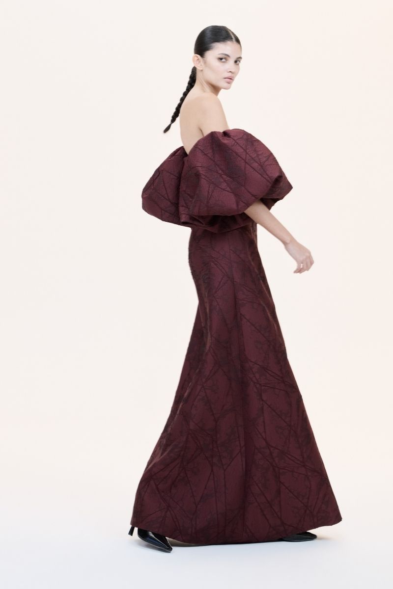Nihan Peker Mustesna gown featuring elegant fabric and intricate design, showcased on a model.