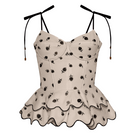 Estefania Rosita peplum top in ivory and black, featuring a fitted bodice and flared peplum hem.