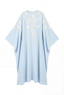 Light blue floral embellished maxi dress by Shatha Essa with intricate floral details and flowing fabric.