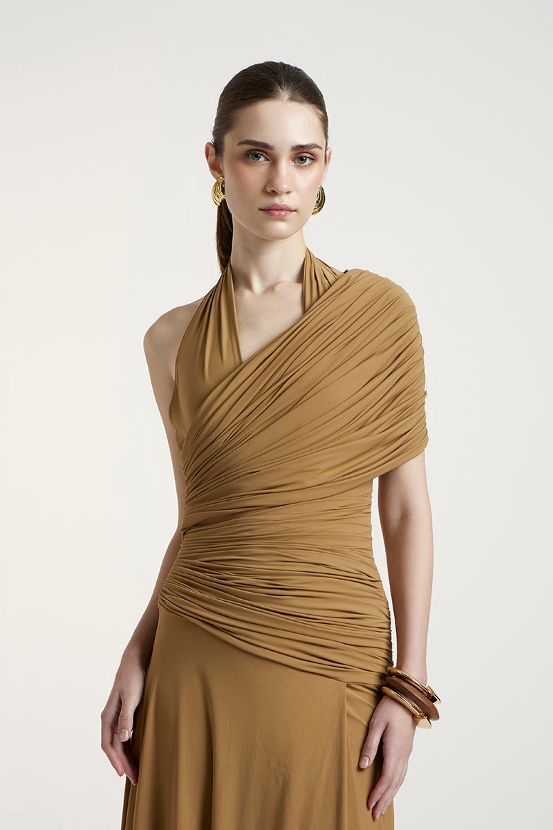 Deme By Gabriella Sharon maxi dress in dark beige, flowing fabric, sleeveless design, and elegant length.