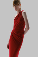 Red Baobab CELELE maxi dress displayed on a hanger with flowing fabric and a stylish silhouette.