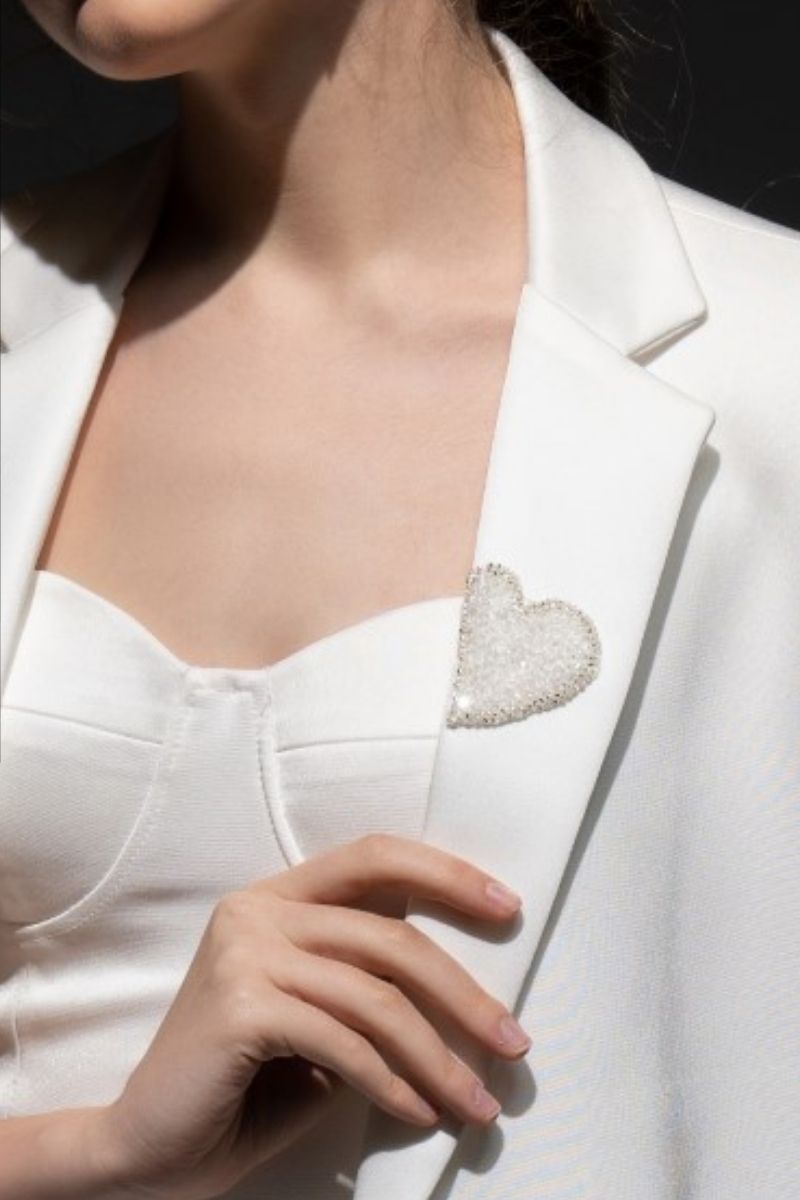 White Kiera Taffeta Feather Blazer Set by 21Six, featuring a stylish feather-adorned blazer and co-ord matching pants.
