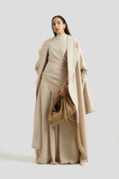 Deme By Gabriella Antonia beige three-piece co-ords outfit set with matching top, pants, and blazer on a model.