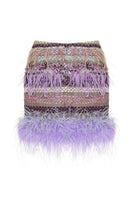 Lalo Avril mini skirt in purple multicolor fabric with a fitted waist and short hemline, styled with casual accessories.