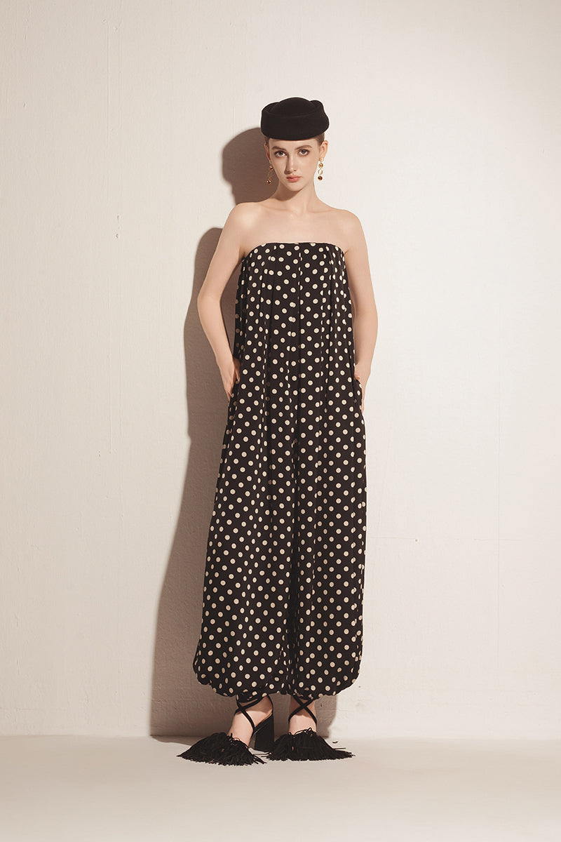 Black Valenciani jumpsuit featuring a fitted silhouette and stylish design, shown in a full-length image.