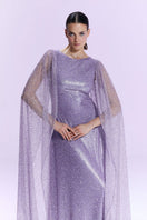 Nur Karaata La Mamounia purple gown with flowing fabric and elegant design, displayed on a mannequin.